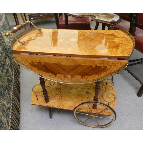 55 - A modern Italian marquetry decorated, two tier tea trolley  29