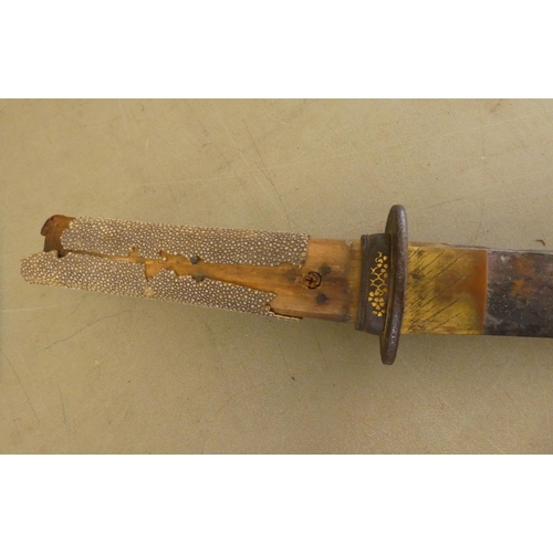 58 - An early 20thC Japanese Katana with a shagreen clad handle  the blade 21