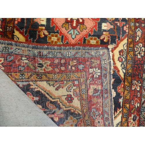 69 - A Persian runner with floral motifs, on a blue ground  35