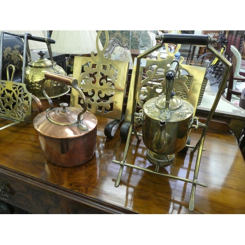 99 - Victorian and later functional metalware: to include fireside stands; companions; mugs; and kettles