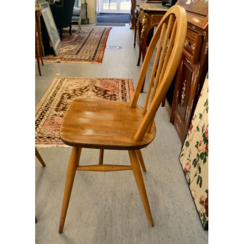 21 - A set of five Ercol (probably) beech and elm framed, hoop and spindled back chairs, the solid seats ... 