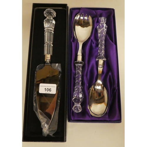 106 - Giftware: to include a pair of stainless steel salad servers, on Edinburgh Crystal handles  box... 