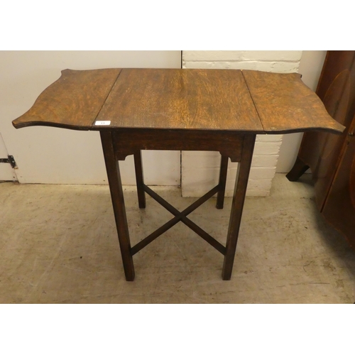 11 - A 1920s oak drop leaf occasional table, raised on square legs  28