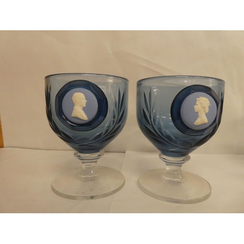 116 - A set of five Wedgwood blue pedestal glasses, each set with a jasperware plaque