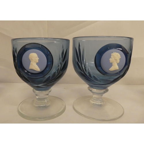 116 - A set of five Wedgwood blue pedestal glasses, each set with a jasperware plaque