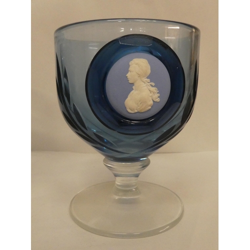 116 - A set of five Wedgwood blue pedestal glasses, each set with a jasperware plaque