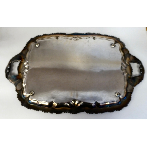 122 - A late Victorian silver plated serving tray with an ornate floral cast border with opposing handles&... 