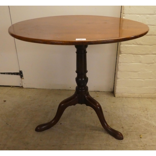 13 - A George III mahogany pedestal table, on a turned and carved column, raised on a tripod base  27