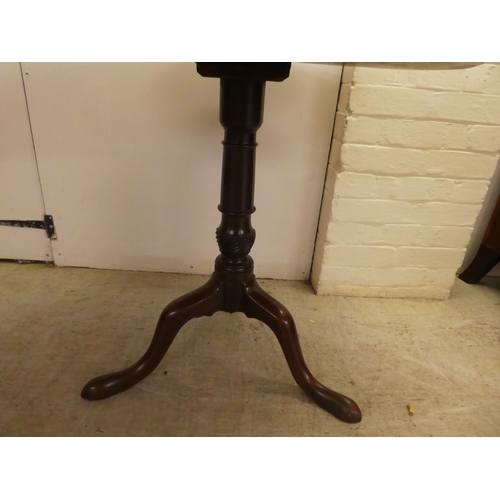 13 - A George III mahogany pedestal table, on a turned and carved column, raised on a tripod base  27