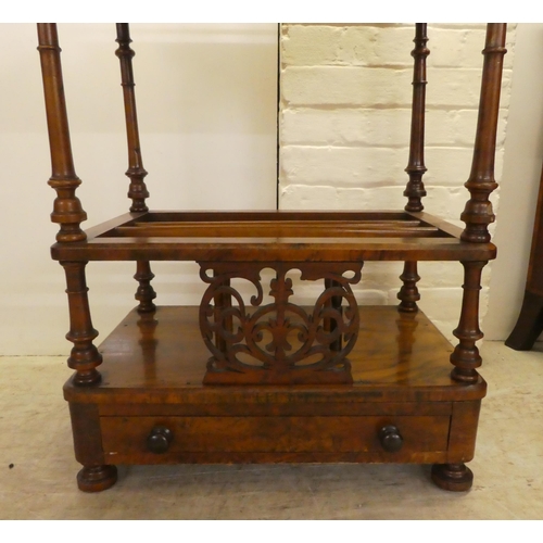 14 - A late Victorian walnut side table/Canterbury, over a base drawer, on turned feet  31