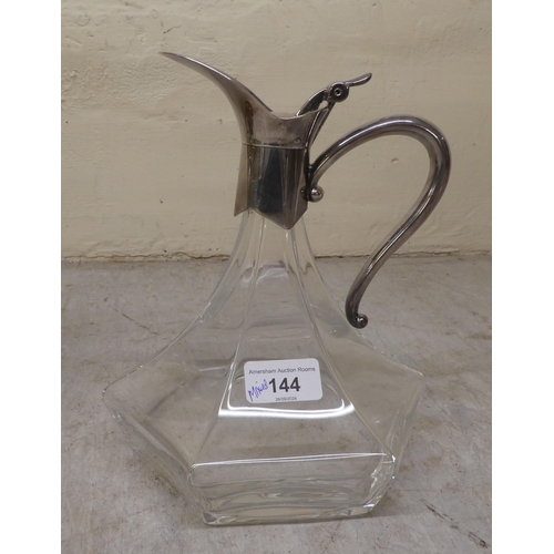 144 - A mixed lot: to include a decanter with a silver plated collar, lid and handle 