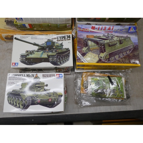 154 - 1/35 scale model kits: to include by Tamiya a 'M4A3 Sherman'; and a 'White M3A1 Scout Car' by Airfix... 