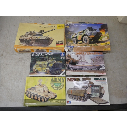 154 - 1/35 scale model kits: to include by Tamiya a 'M4A3 Sherman'; and a 'White M3A1 Scout Car' by Airfix... 