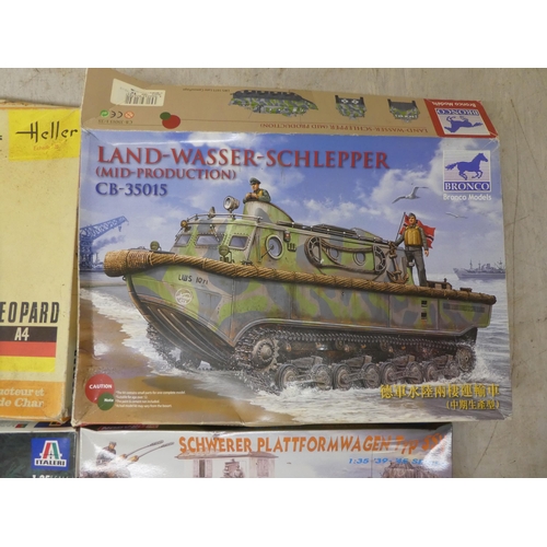 154 - 1/35 scale model kits: to include by Tamiya a 'M4A3 Sherman'; and a 'White M3A1 Scout Car' by Airfix... 