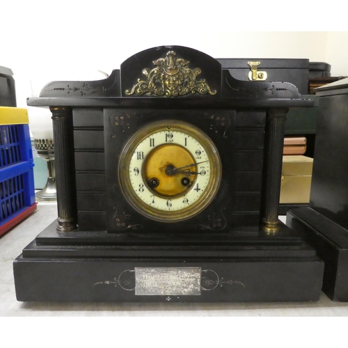 158 - Two similar late Victorian black slate cased mantel clocks of architectural form; faced by Roman and... 