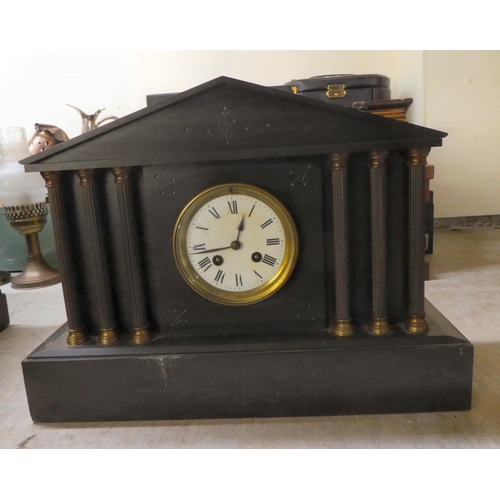 158 - Two similar late Victorian black slate cased mantel clocks of architectural form; faced by Roman and... 