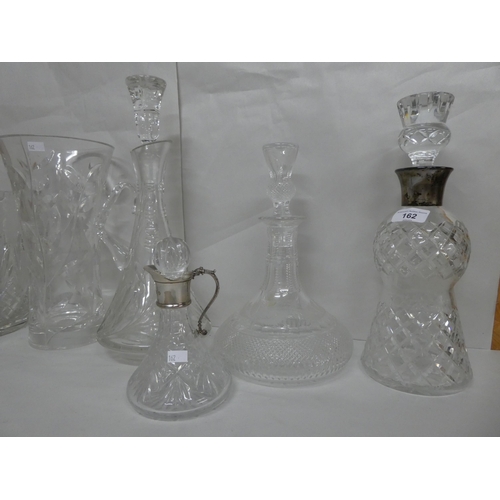 162 - Glassware: to include a lead crystal, thistle design decanter with a silver collar  marks indis... 