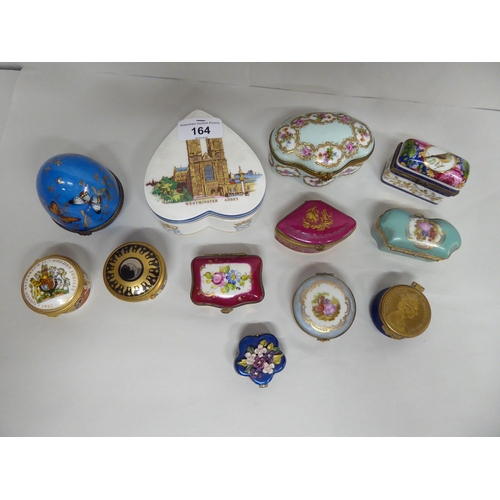 164 - Pill, patch and trinket boxes: to include a porcelain example, decorated with butterflies