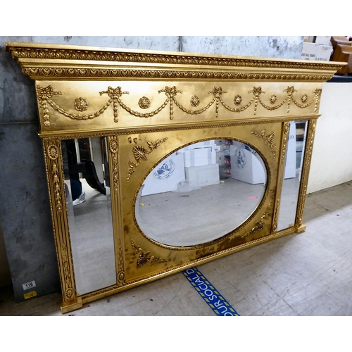 166 - A modern Regency design, gilt painted, wood framed overmantel mirror with triple plates  32