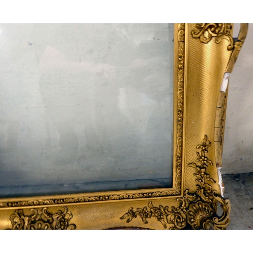 168 - A late Victorian gilded gesso picture frame of ornate pierced design  the aperture  22