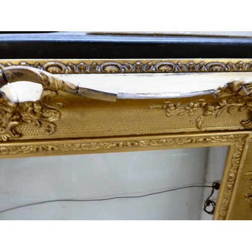 168 - A late Victorian gilded gesso picture frame of ornate pierced design  the aperture  22