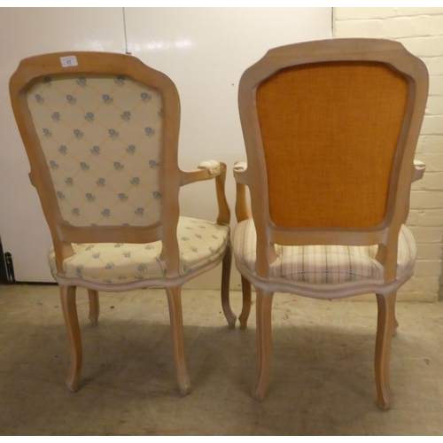 17 - A pair of modern antique French inspired cream wash painted, open arm salon chairs