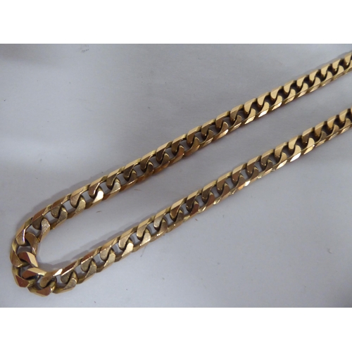 170 - A 9ct gold flat curb link neckchain 68 grams