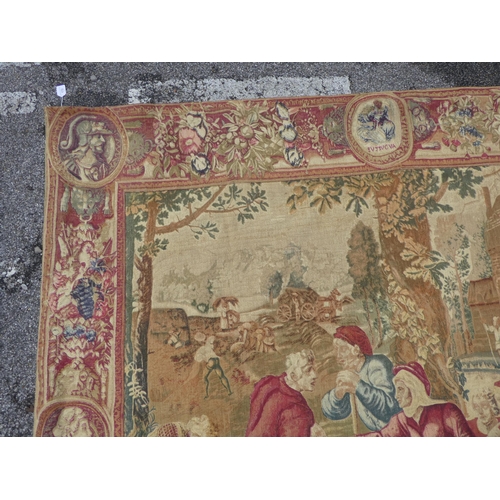 172 - A 20thC Belgian tapestry, depicting figures in a courtyard setting  77