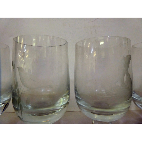 184 - A set of twelve 1970s pedestal drinking glasses, each etched with a different animal  bearing i... 