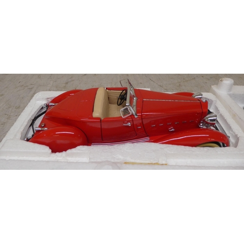 195 - Five Danbury Mint diecast model vehicles: to include a '1934 Packard V-12 LeBaron Speedster'; and a ... 