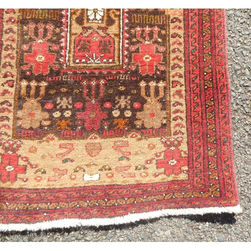 205 - A prayer rug, on a red ground  20