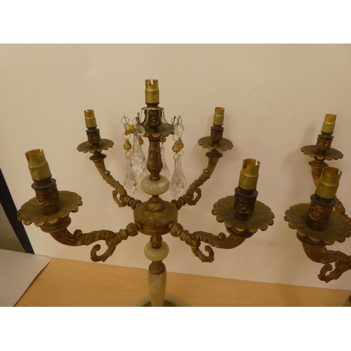 226 - A pair of gilt metal and onyx, five branch candelabra  22