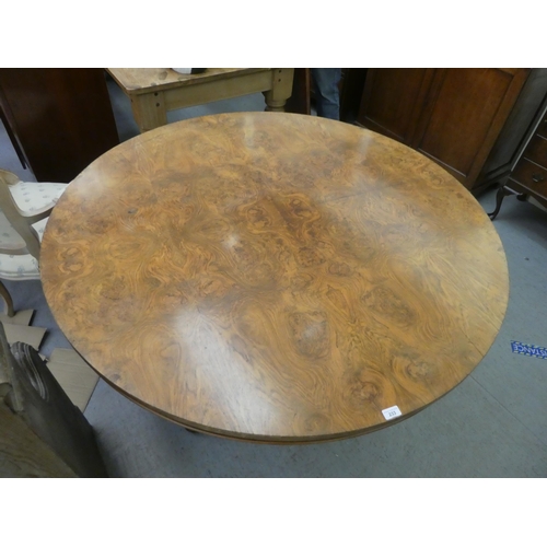 233 - An early Victorian quarter burr walnut veneered centre table, raised on a bulbous column and carved ... 