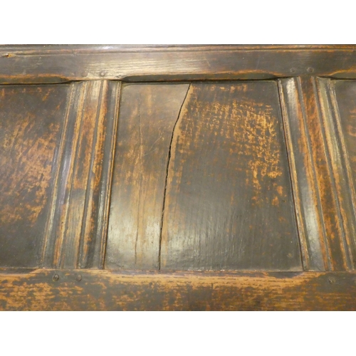 244 - A mid 18thC panelled oak coffer with straight sides and a hinged lid, raised on straight legs  ... 