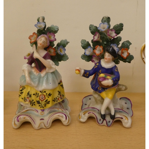 257 - Ceramics: to include a pair of late 19thC Meissen porcelain stands, each surmounted by a figure ... 