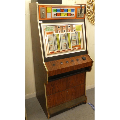 258 - Vintage rosewood effect, laminated and steel bound, cased electronic operated fruit machine by JPM M... 