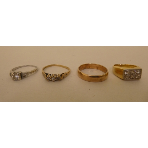 267 - A gold coloured metal wedding ring; another gold coloured metal pave set diamond ring; a 14ct white ... 