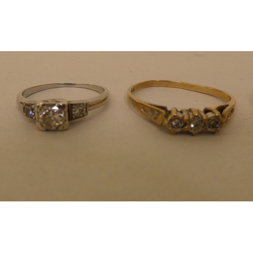 267 - A gold coloured metal wedding ring; another gold coloured metal pave set diamond ring; a 14ct white ... 