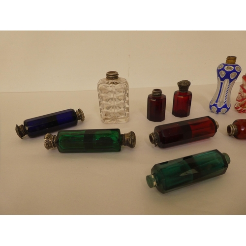 275 - Various late 19thC coloured glass scent bottles; some with silver caps  various designs 