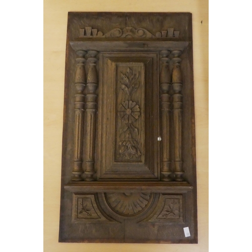 280 - Wooden collectables: to include a late 19thC carved oak furniture panel  19