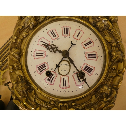 283 - A late 19thC brass cased Comptoise clock; the 8 day movement faced by an enamelled roman dial  16