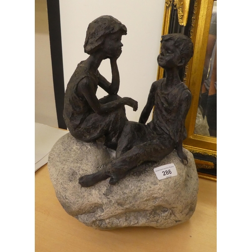 286 - A mixed lot: to include a composition stone model, two children sitting on a rock  16