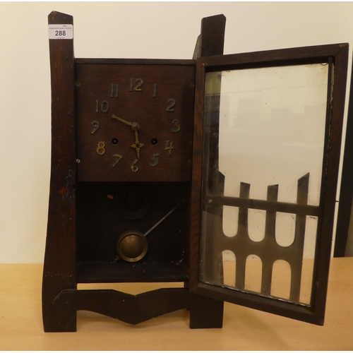 288 - An early 20thC Arts & Crafts oak cased mantel clock; the 8 day movement faced by an Arabic dial ... 