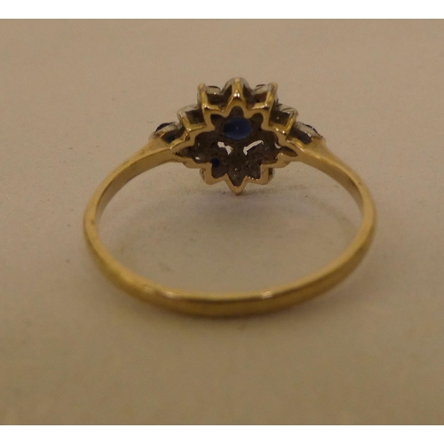 293 - A 9ct gold sapphire and diamond cluster ring