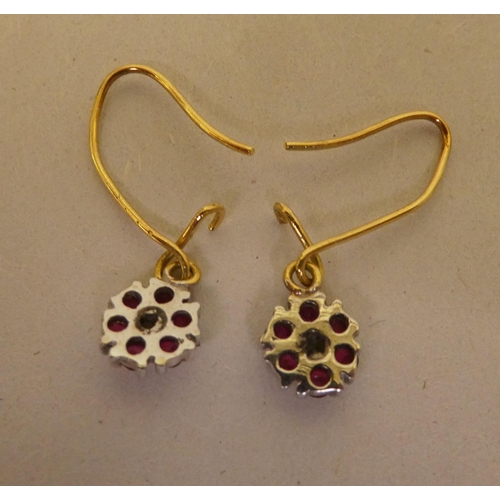 295 - A pair of 9ct gold ruby and diamond cluster pendant earrings