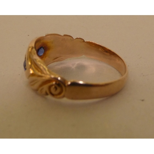 299 - A 9ct gold sapphire and diamond gypsy ring