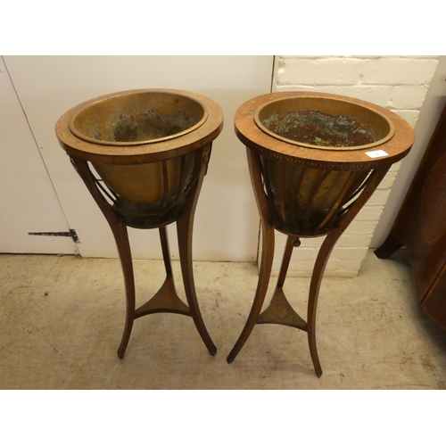 3 - Two similar late 19th/early 20thC oak/mahogany jardinière stands  35