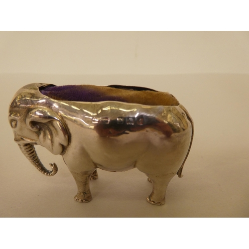 302 - An Edwardian silver novelty pin cushion, fashioned as a standing elephant  Birmingham 1905 ... 