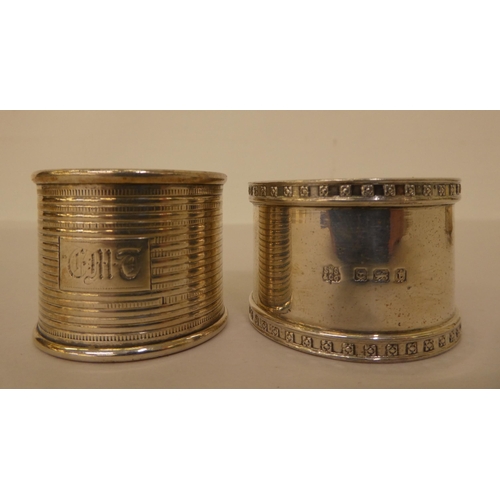 303 - Silver and white metal items: to include two napkin rings and two silver thimbles 