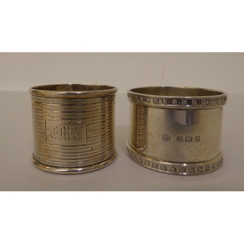 303 - Silver and white metal items: to include two napkin rings and two silver thimbles 